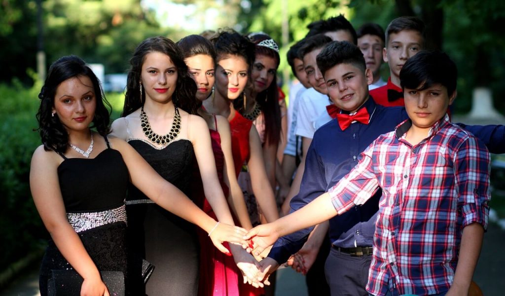 A group of teenagers posing as couples