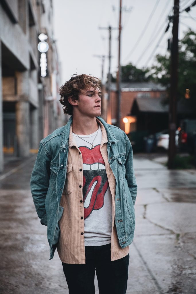 Young man in a Rolling Stones t-shirt in a street