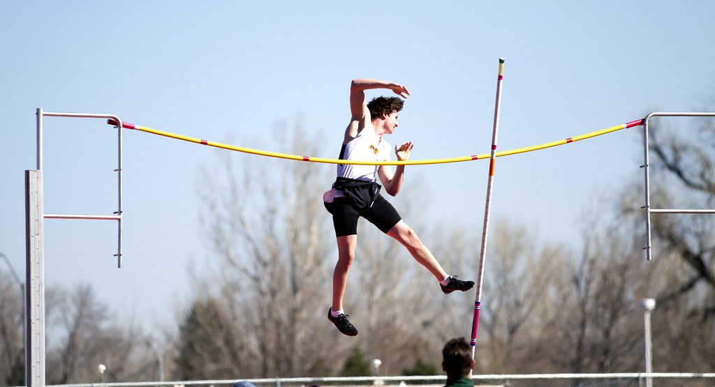 An athlete jumping over the bar