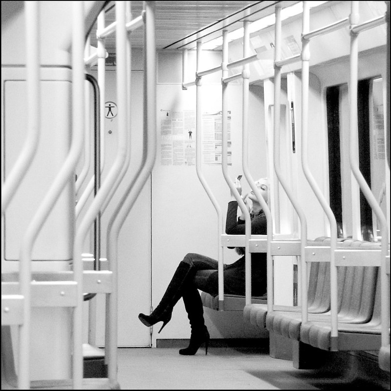 Girl doing make-up in metro