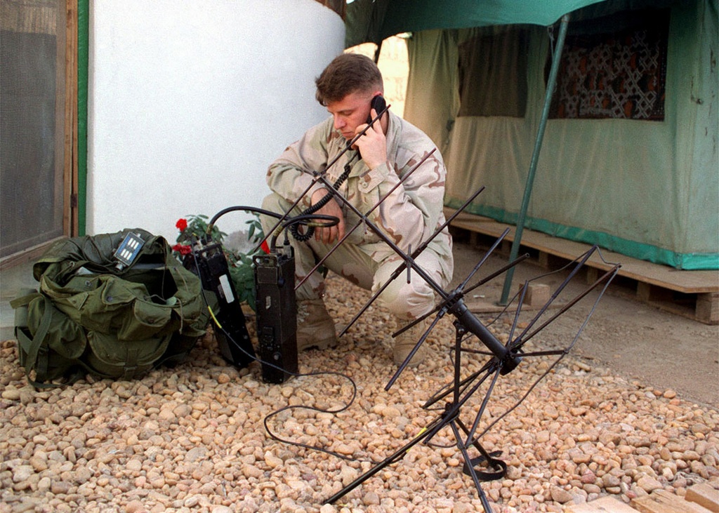 Sergeant Clark from Joint Chief Support Element (JCSE), radios back a situation report while serving as the radio operator for a five day recon mission in support of Joint Task Force Kenya, operation Noble Response.