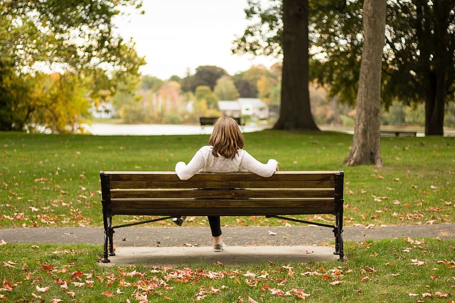 Woman chilling at a park bench